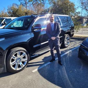 https://seedandspark-static.s3.us-east-2.amazonaws.com/images/User/001/872/522/medium/chauffeur-escalade-suited.jpg image